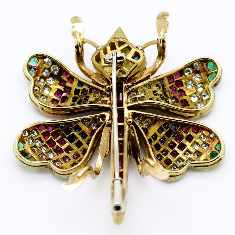 Spilla farfalla anni '70 firmata Cazzanica in oro giallo e bianco con rubini zaffiri smeraldi e diamanti